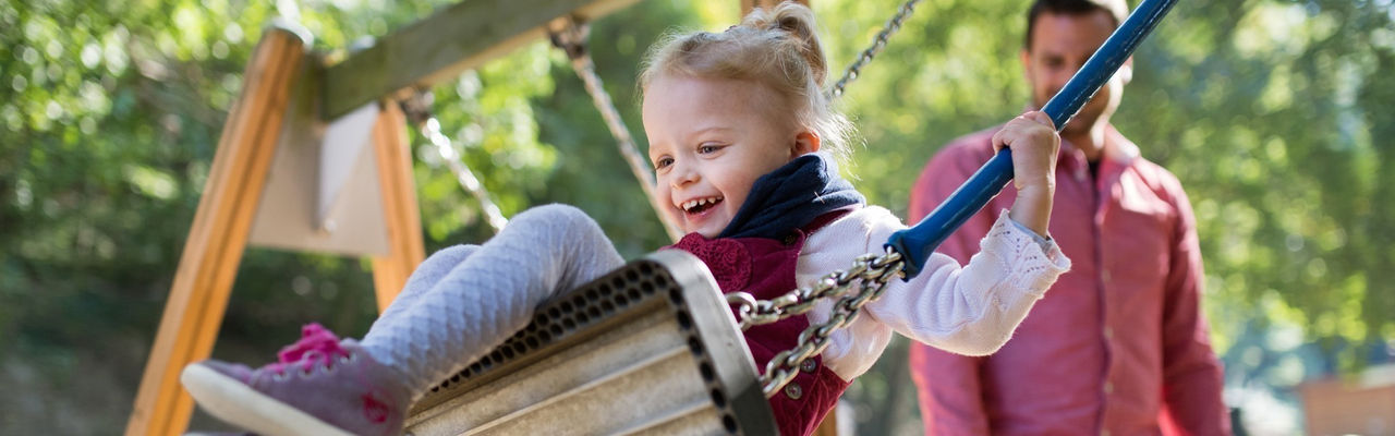 Smiling child on swing