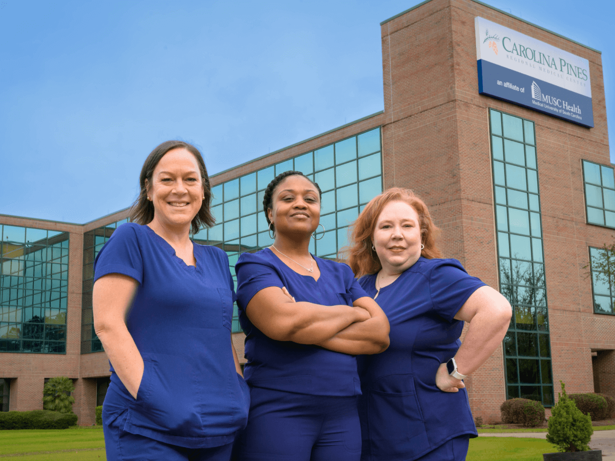 Ashley Brown, Komesha Ashe, & Karen Hunter depicted in front of Carolina Pines Regional Medical Center